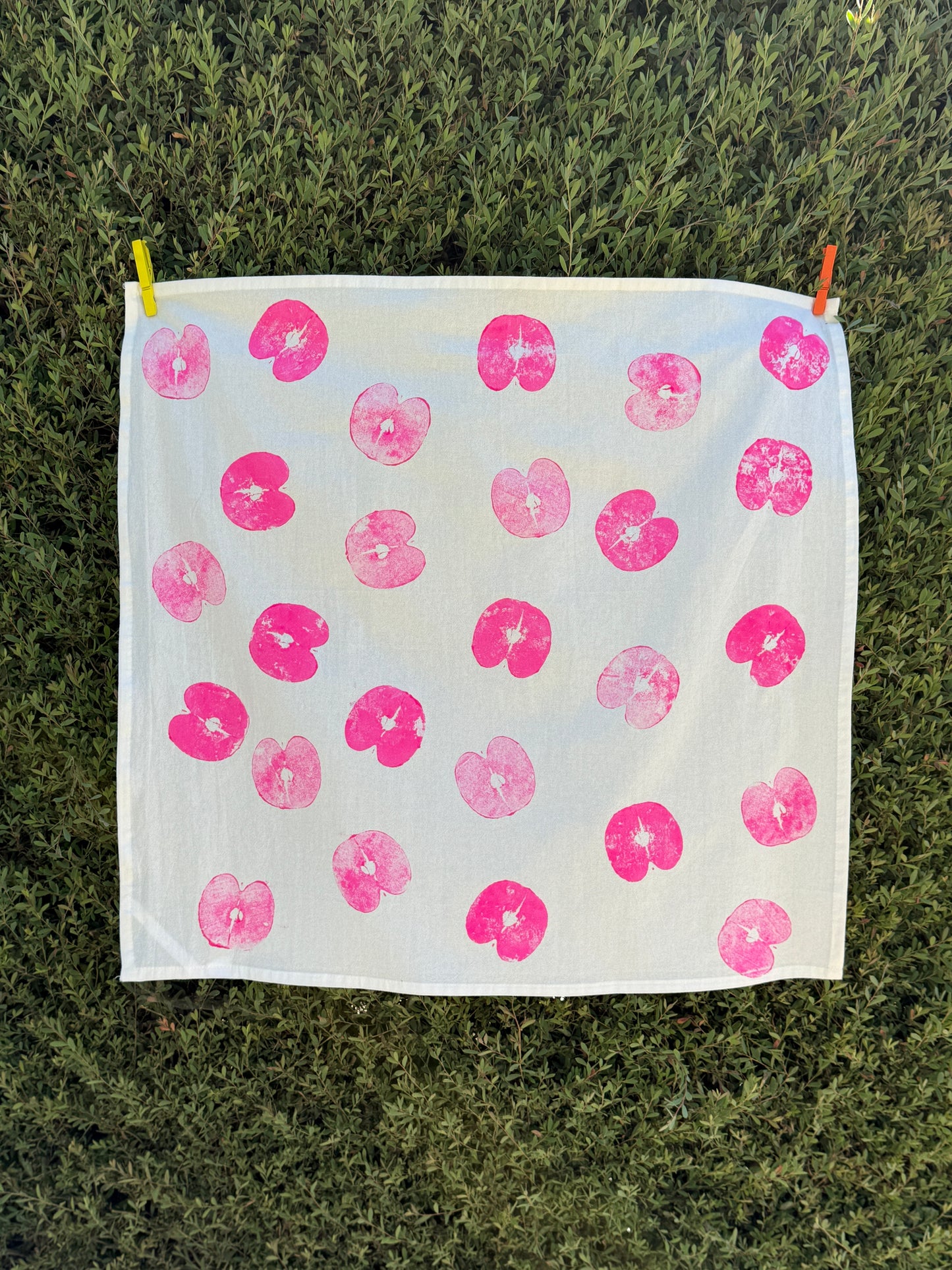 handprinted cotton dish towel with neon magenta apple print