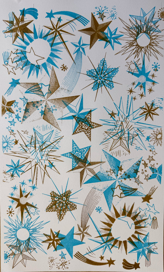 riso print on cardstock of images of stars in layers of ink in aqua and gold ink